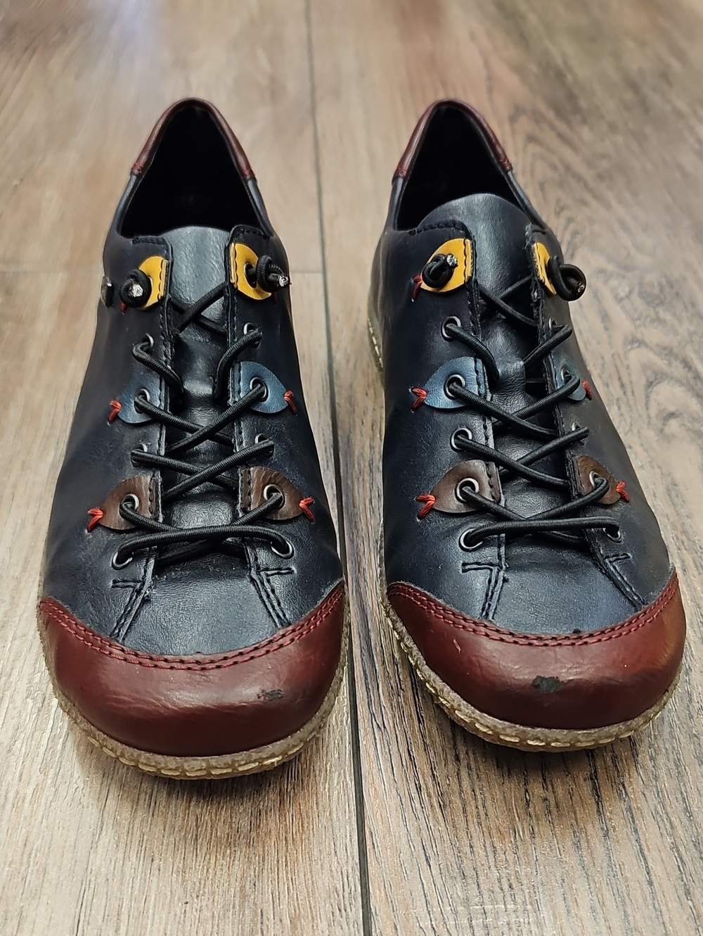 Rieker Black Leather Lace-Up Loafers with Brown Toe and Yellow Accents